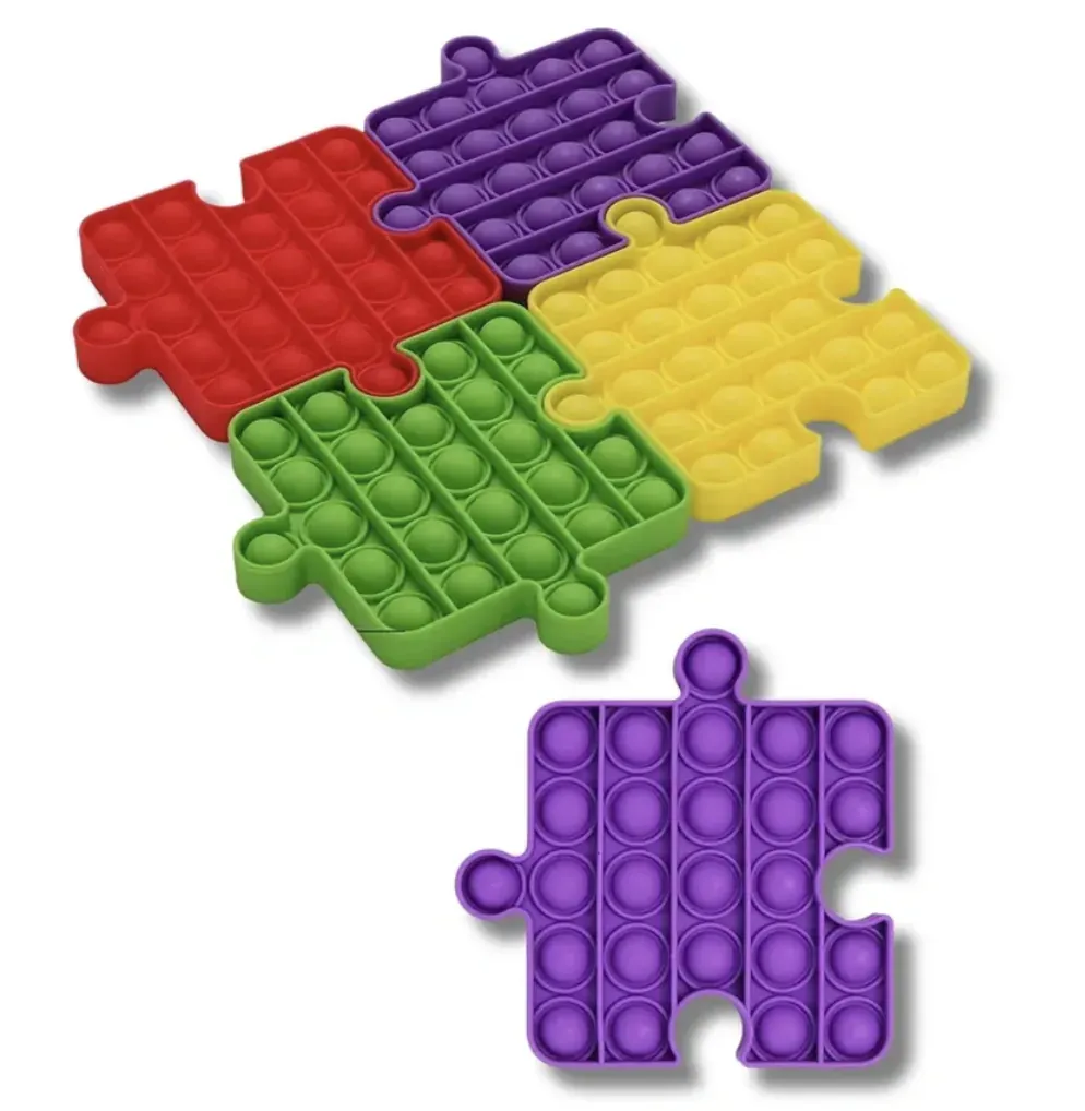 Puzzle pop-it sensory toy for fidgeting and tactile regulation.
